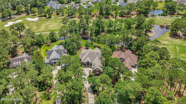 545 Gladstone Cir SW, Ocean Isle Beach, NC 28469 - aerial perspective of suburban area with a golf course and a nearby body of water
