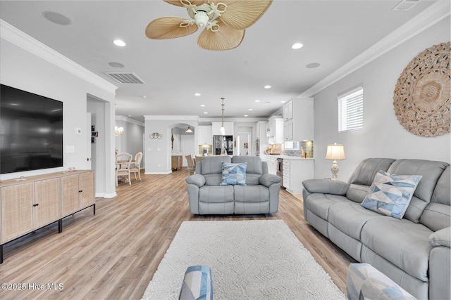3236 Penzance Row, Wilmington, NC 28412 - living room with ornamental molding, light wood finished floors, recessed lighting, and ceiling fan