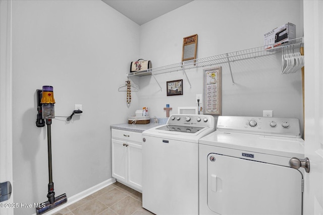 3236 Penzance Row, Wilmington, NC 28412 - laundry room featuring washer and dryer, cabinet space, and light tile patterned floors