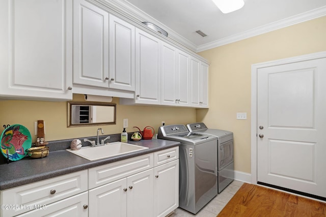 220 October Glory Dr, Wallace, NC 28466 - washroom with washer and dryer, cabinet space, crown molding, and light tile patterned flooring