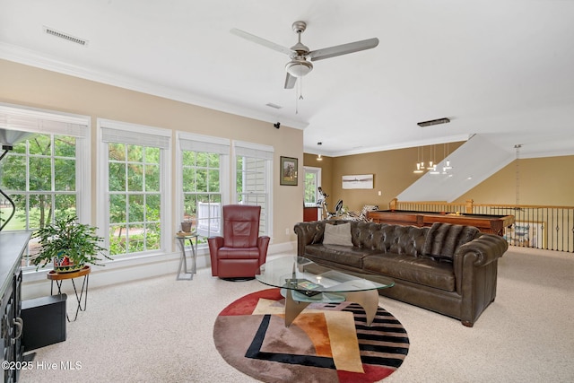 220 October Glory Dr, Wallace, NC 28466 - carpeted living area with a ceiling fan, healthy amount of natural light, and ornamental molding