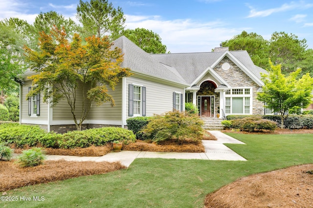 220 October Glory Dr, Wallace, NC 28466 - craftsman house with a front yard, a chimney, stone siding, and roof with shingles