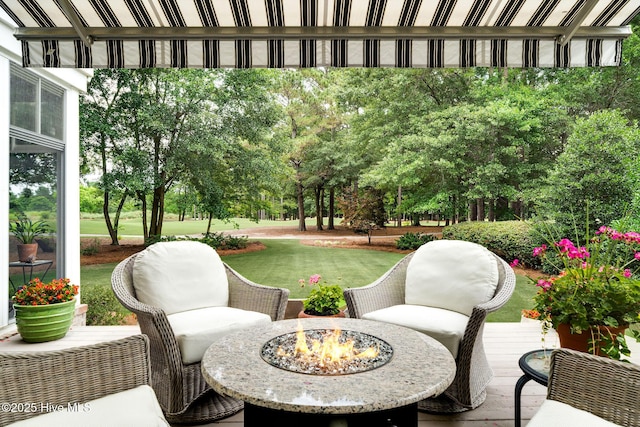 220 October Glory Dr, Wallace, NC 28466 - view of patio with an outdoor fire pit, a deck, and view of scattered trees