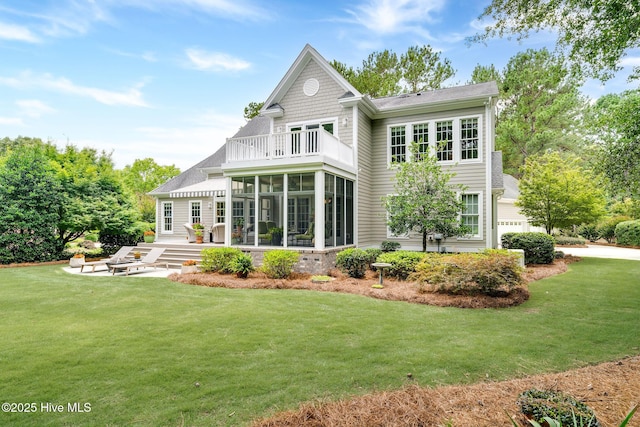 220 October Glory Dr, Wallace, NC 28466 - back of house with a sunroom, a balcony, and a yard