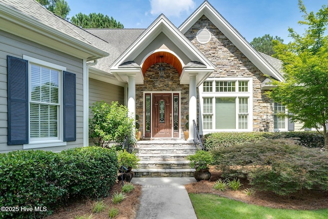 220 October Glory Dr, Wallace, NC 28466 - entrance to property with stone siding and roof with shingles