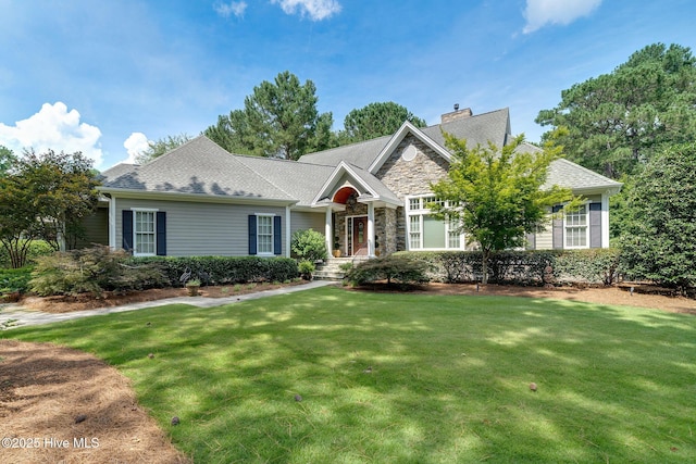 220 October Glory Dr, Wallace, NC 28466 - view of front of property featuring a front yard, stone siding, and a chimney