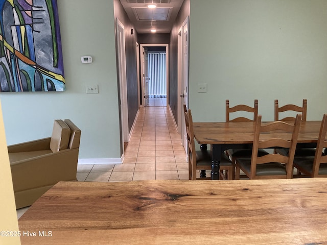 7417 Coker Ct, Wilmington, NC 28411 - dining room featuring light tile patterned floors and attic access