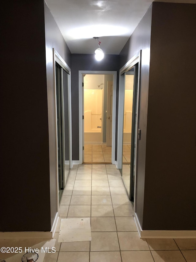 7417 Coker Ct, Wilmington, NC 28411 - corridor with light tile patterned floors and baseboards