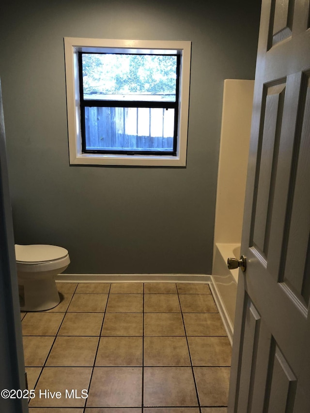 7417 Coker Ct, Wilmington, NC 28411 - bathroom with tile patterned flooring and a tub to relax in