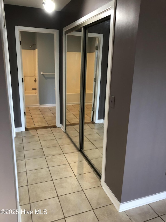 7417 Coker Ct, Wilmington, NC 28411 - corridor with light tile patterned floors and baseboards