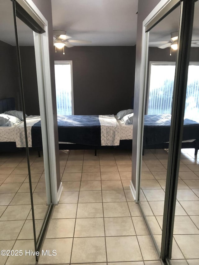 7417 Coker Ct, Wilmington, NC 28411 - bedroom featuring light tile patterned flooring and a ceiling fan