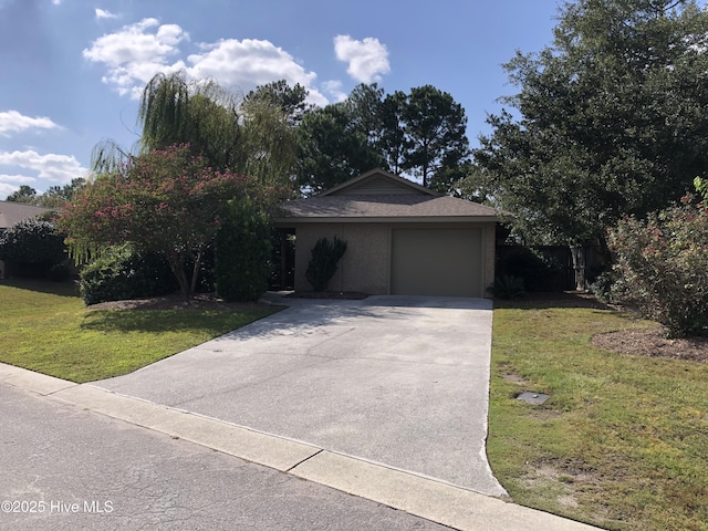 7417 Coker Ct, Wilmington, NC 28411 - ranch-style home with concrete driveway, a front lawn, and an attached garage