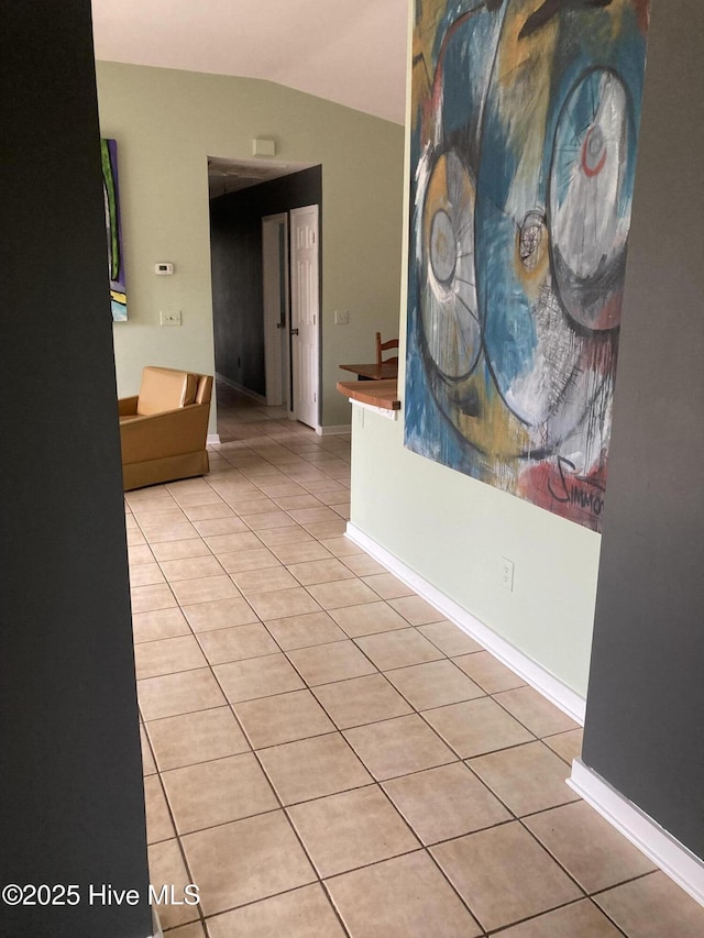 7417 Coker Ct, Wilmington, NC 28411 - hallway with light tile patterned floors and lofted ceiling