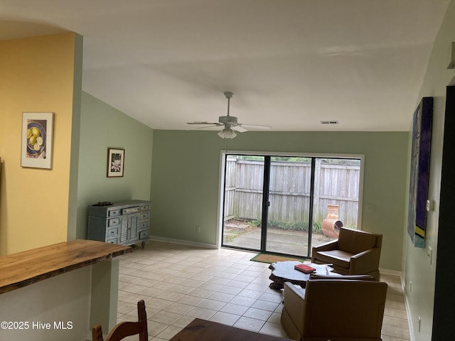 7417 Coker Ct, Wilmington, NC 28411 - living area featuring vaulted ceiling, ceiling fan, and light tile patterned flooring