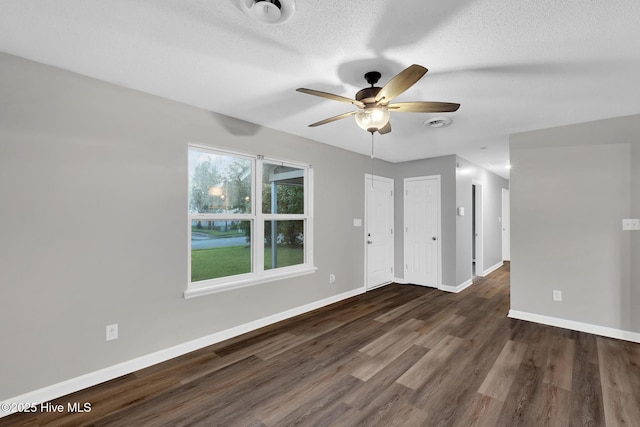 411 Cardinal Dr, Jacksonville, NC 28546 - empty room with a ceiling fan, wood finished floors, and a textured ceiling