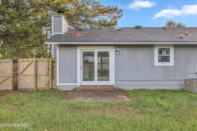 411 Cardinal Dr, Jacksonville, NC 28546 - rear view of house with entry steps, a gate, and a chimney