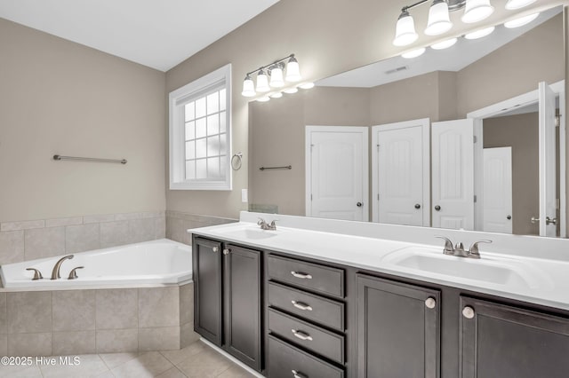 707 Liberty Landing Way, Wilmington, NC 28409 - full bathroom with double vanity, a garden tub, and tile patterned flooring