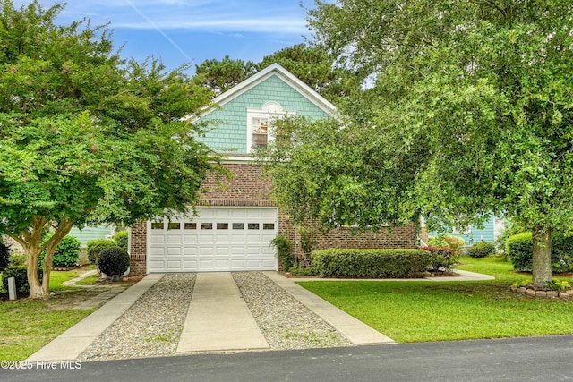 5087 Glen Cove Dr SE, Southport, NC 28461 - view of front of house featuring brick siding, driveway, an attached garage, and a front yard