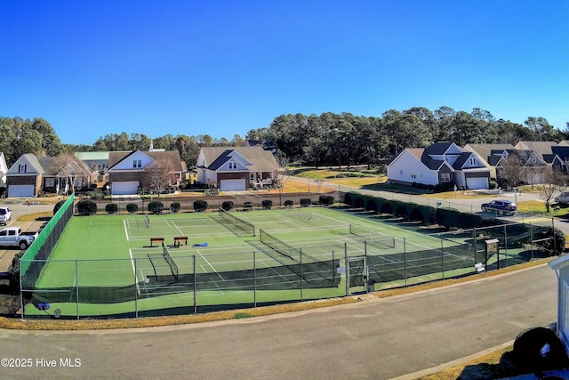 5087 Glen Cove Dr SE, Southport, NC 28461 - view of tennis court featuring a residential view