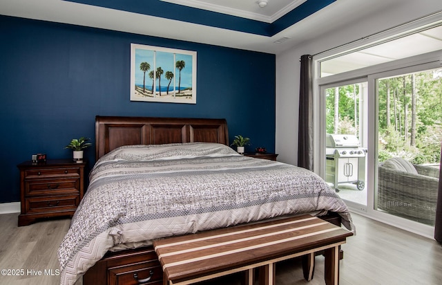 440 Bramble Ln, Clayton, NC 27527 - bedroom featuring access to exterior, light wood finished floors, and ornamental molding