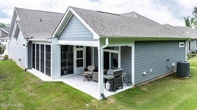440 Bramble Ln, Clayton, NC 27527 - rear view of property with a patio, roof with shingles, a lawn, and a sunroom