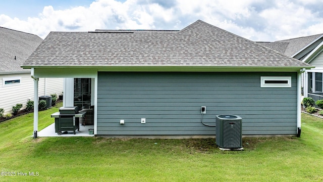 440 Bramble Ln, Clayton, NC 27527 - back of property featuring a shingled roof, a lawn, and a patio area