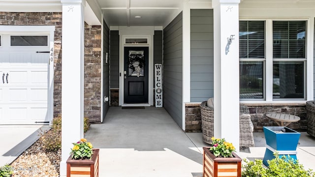 440 Bramble Ln, Clayton, NC 27527 - property entrance with a porch and stone siding