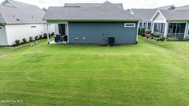 440 Bramble Ln, Clayton, NC 27527 - rear view of house featuring a yard, roof with shingles, a patio, and a sunroom