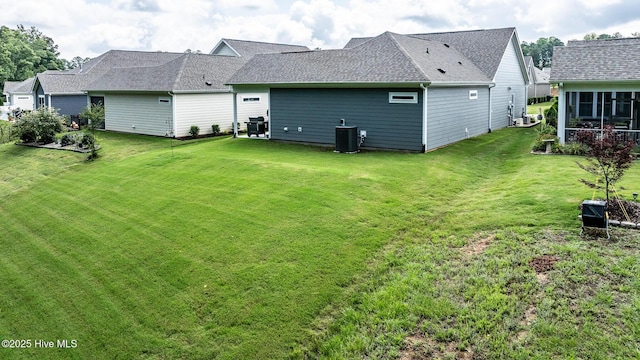 440 Bramble Ln, Clayton, NC 27527 - back of property featuring a lawn and roof with shingles