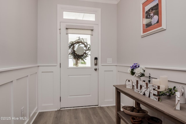 440 Bramble Ln, Clayton, NC 27527 - foyer entrance with a decorative wall, a wainscoted wall, and wood finished floors