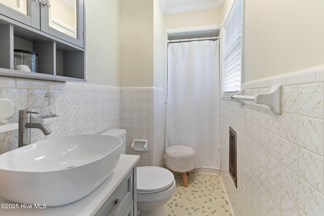 84 White Pine Rd, Lake Waccamaw, NC 28450 - full bathroom featuring tile walls, ornamental molding, a wainscoted wall, vanity, and a shower with shower curtain