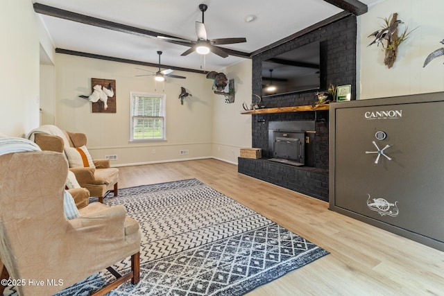 84 White Pine Rd, Lake Waccamaw, NC 28450 - living area with wood finished floors, ceiling fan, crown molding, and a fireplace
