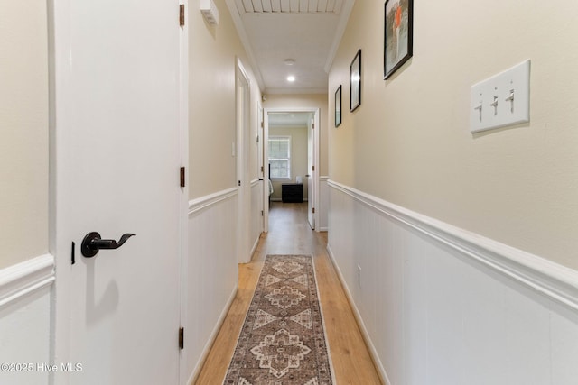 84 White Pine Rd, Lake Waccamaw, NC 28450 - hall featuring light wood-style floors, crown molding, and wainscoting