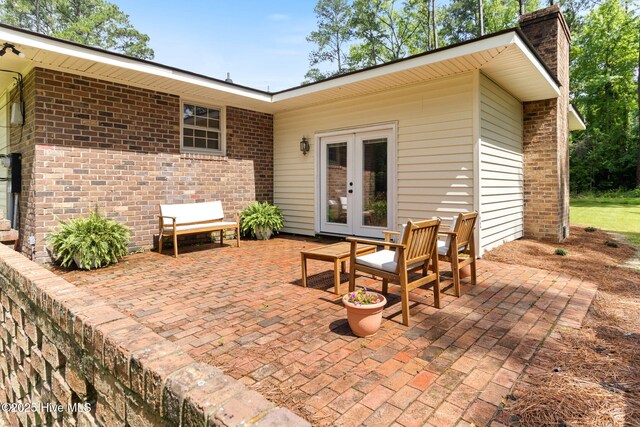 84 White Pine Rd, Lake Waccamaw, NC 28450 - view of patio featuring french doors