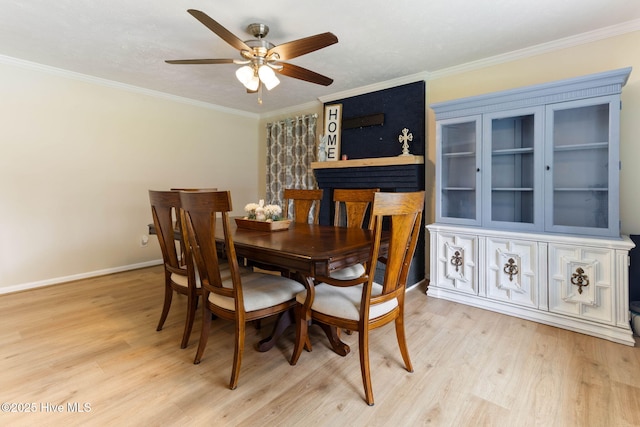 84 White Pine Rd, Lake Waccamaw, NC 28450 - dining area featuring light wood-style floors, ceiling fan, and crown molding