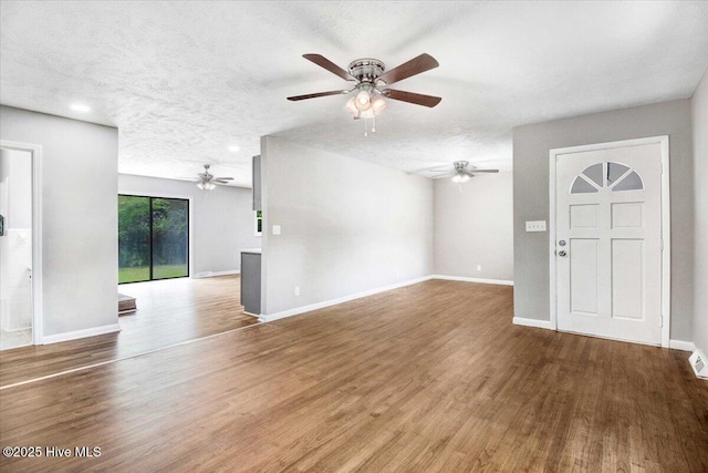 527 W College St, Warsaw, NC 28398 - unfurnished living room with ceiling fan, wood finished floors, and a textured ceiling