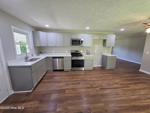 527 W College St, Warsaw, NC 28398 - kitchen featuring stainless steel appliances, gray cabinetry, recessed lighting, dark wood-style floors, and ceiling fan