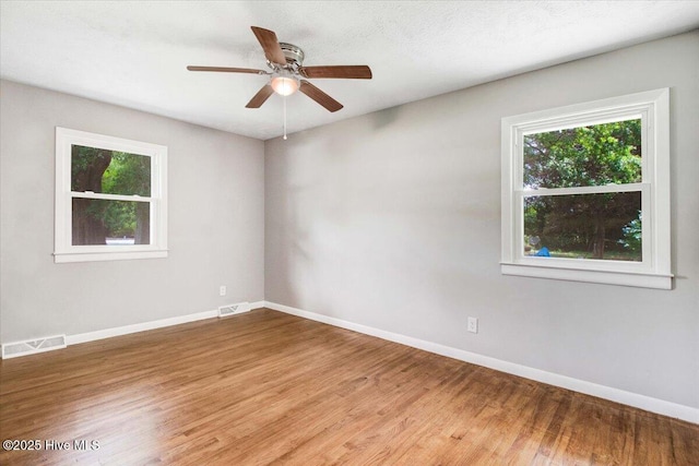 527 W College St, Warsaw, NC 28398 - spare room featuring wood finished floors and a ceiling fan