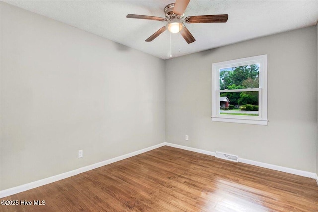 527 W College St, Warsaw, NC 28398 - spare room with wood finished floors and a ceiling fan