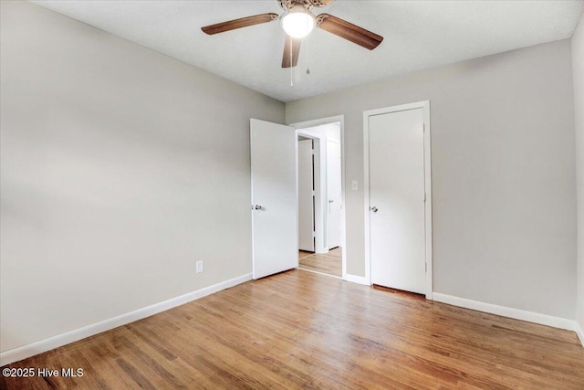527 W College St, Warsaw, NC 28398 - unfurnished bedroom with wood finished floors and ceiling fan