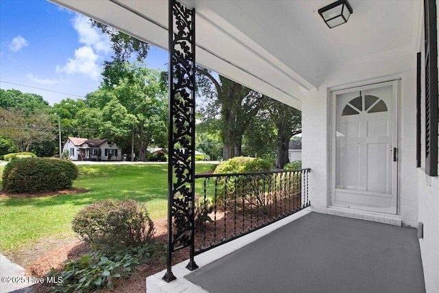 527 W College St, Warsaw, NC 28398 - view of exterior entry with brick siding and a lawn