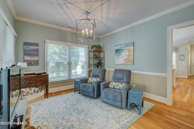 4929 Lake Renaissance Cir, Wilmington, NC 28409 - living area with ornamental molding, wood finished floors, and a chandelier