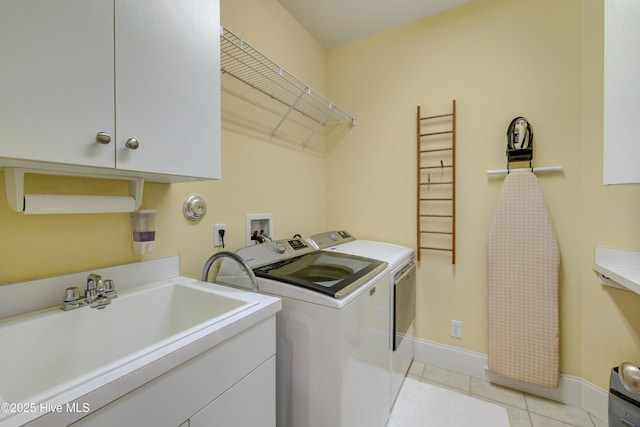 4929 Lake Renaissance Cir, Wilmington, NC 28409 - washroom featuring cabinet space, separate washer and dryer, and light tile patterned floors