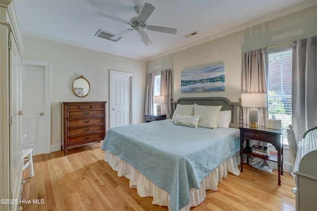 4929 Lake Renaissance Cir, Wilmington, NC 28409 - bedroom featuring light wood finished floors, multiple windows, ornamental molding, ceiling fan, and a closet