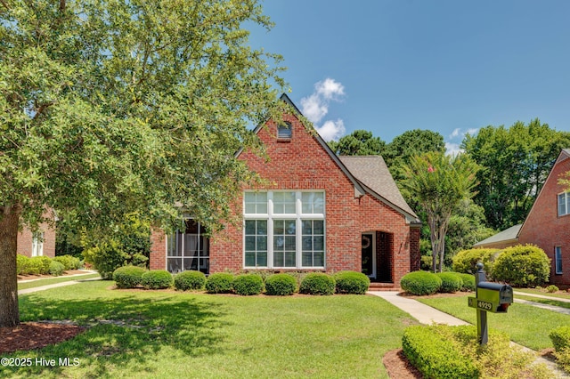 4929 Lake Renaissance Cir, Wilmington, NC 28409 - view of front of property featuring a front lawn and brick siding