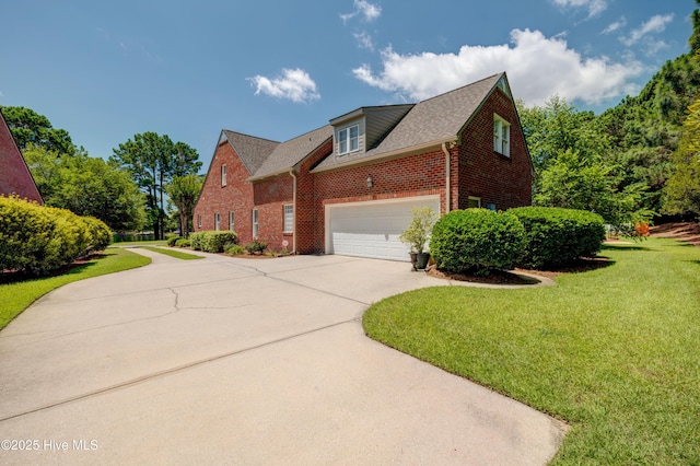 4929 Lake Renaissance Cir, Wilmington, NC 28409 - view of home's exterior featuring driveway, brick siding, and a lawn