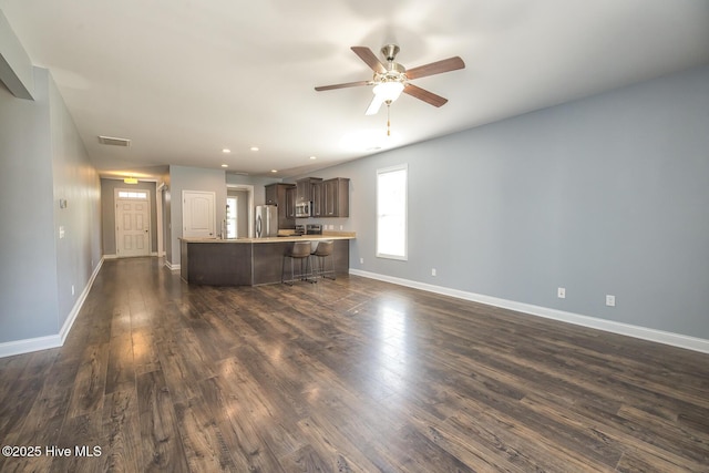 368 Lehigh Rd, Wilmington, NC 28412 - unfurnished living room featuring dark wood-type flooring, ceiling fan, and recessed lighting