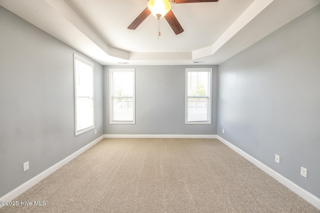 368 Lehigh Rd, Wilmington, NC 28412 - unfurnished room with ceiling fan, light carpet, and a tray ceiling