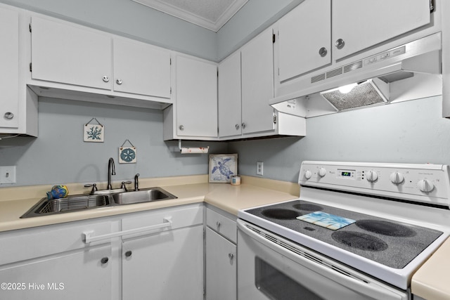 1004 Carolina Beach Ave S Unit A4, Carolina Beach, NC 28428 - kitchen with white electric range oven, under cabinet range hood, ornamental molding, white cabinets, and light countertops