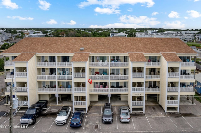 1004 Carolina Beach Ave S Unit A4, Carolina Beach, NC 28428 - view of apartment building / complex featuring uncovered parking